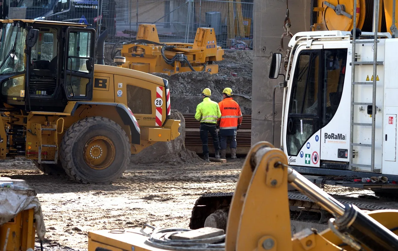 Machinery and workers on a building site.