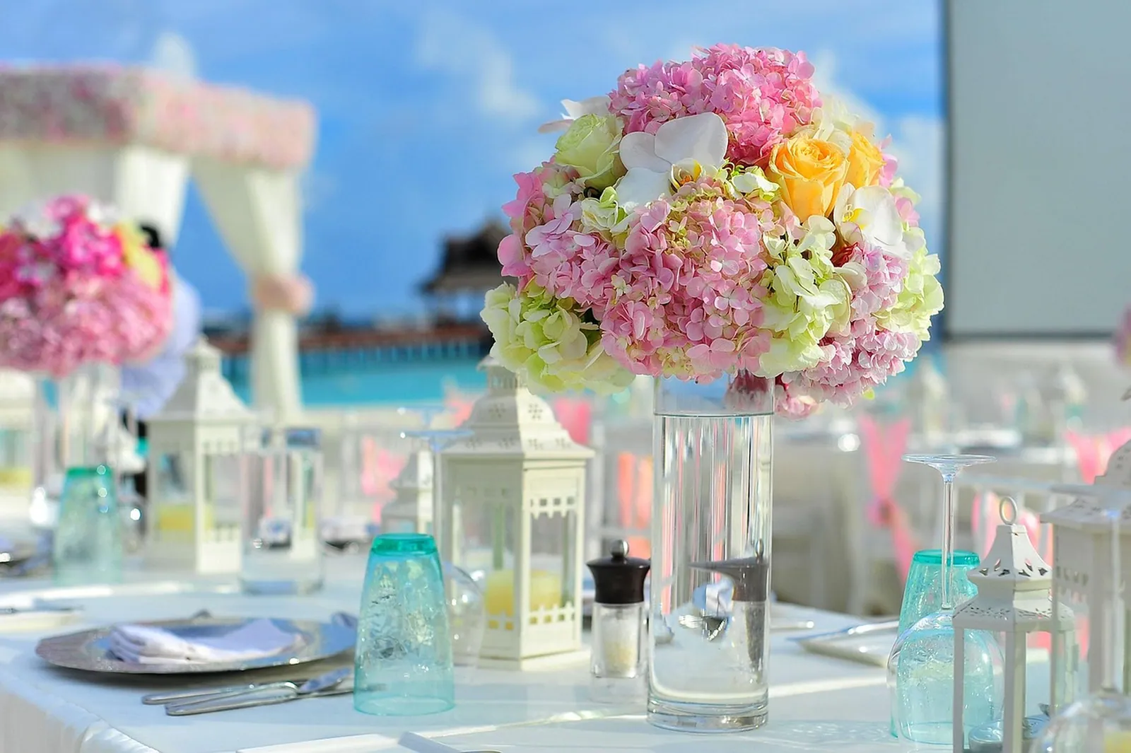 An outdoor table setting with flowers.