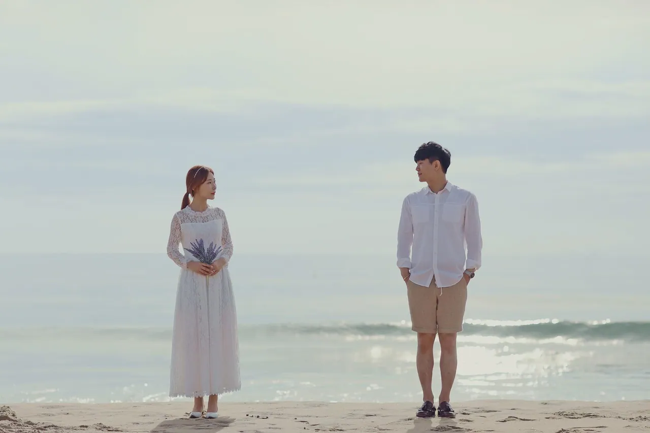 A couple standing together on their wedding day.